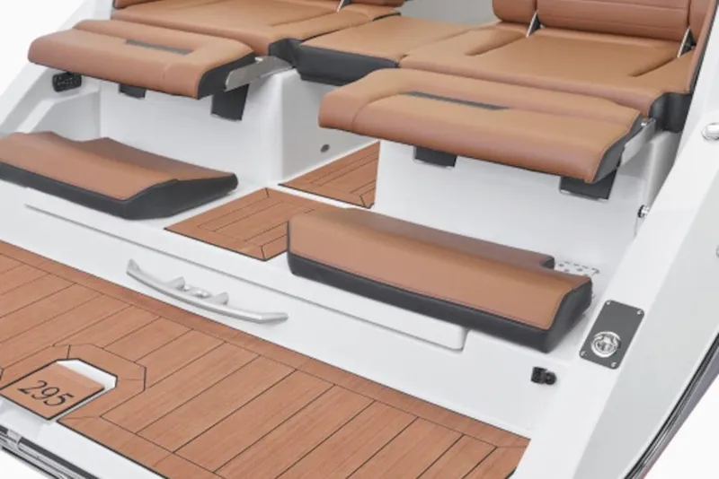 Slide: The Image of 2026 Yamaha Boats 295SE interior with tan seating and teak-style flooring. - 5