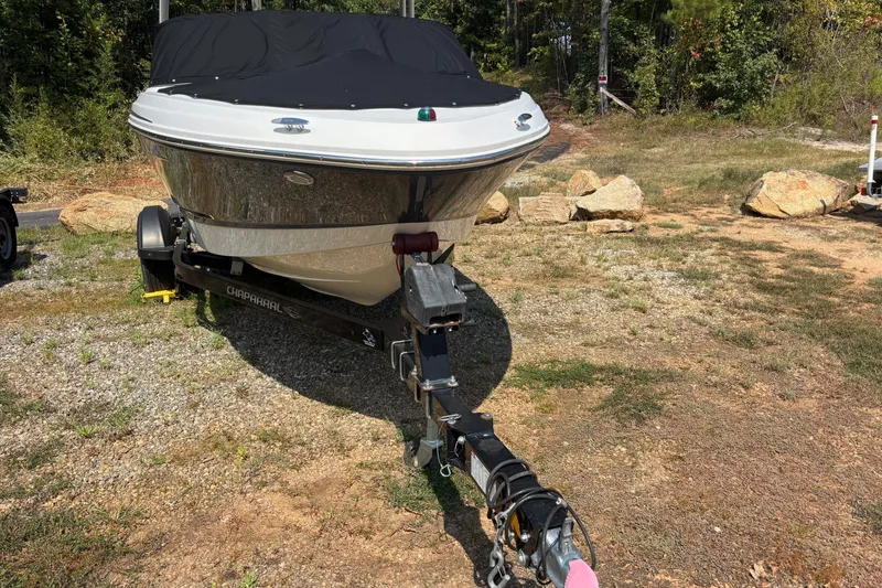 Slide: The Image of 2019 Chaparral 21 H2O Sport boat on trailer, covered, outdoors. - 5