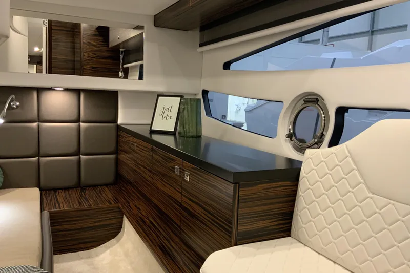 Slide: The Image of Luxurious interior of 2026 Cobrey 33 HT yacht with modern wood finishes and elegant seating. - 6