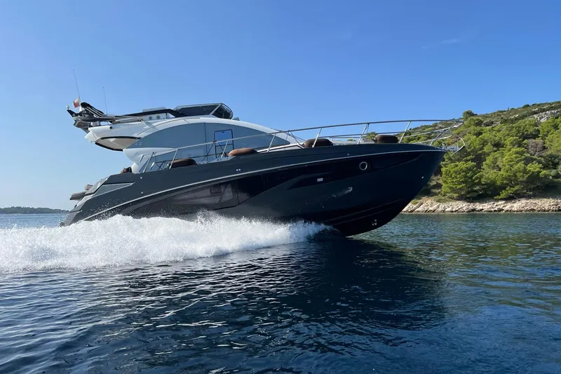 The Image of Luxury Cobrey 45 FLY yacht cruising on clear blue waters, 2026 model. - 0