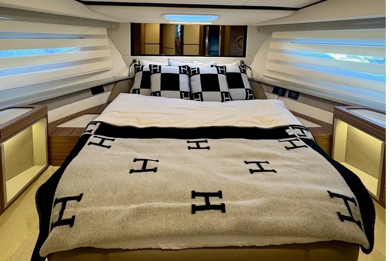 Slide: The Image of Luxurious bedroom interior of 2026 Cobrey 45 FLY yacht with elegant bedding. - 18