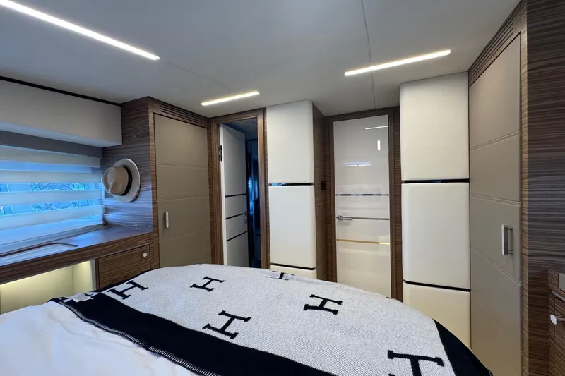 Slide: The Image of Luxurious interior of 2026 Cobrey 45 FLY yacht bedroom with modern design elements. - 20