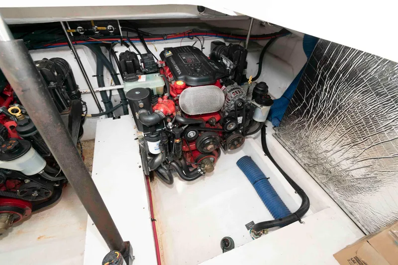 Slide: The Image of Engine room of 2011 Cruisers Yachts 360 Express, showcasing mechanical components and wiring. - 19