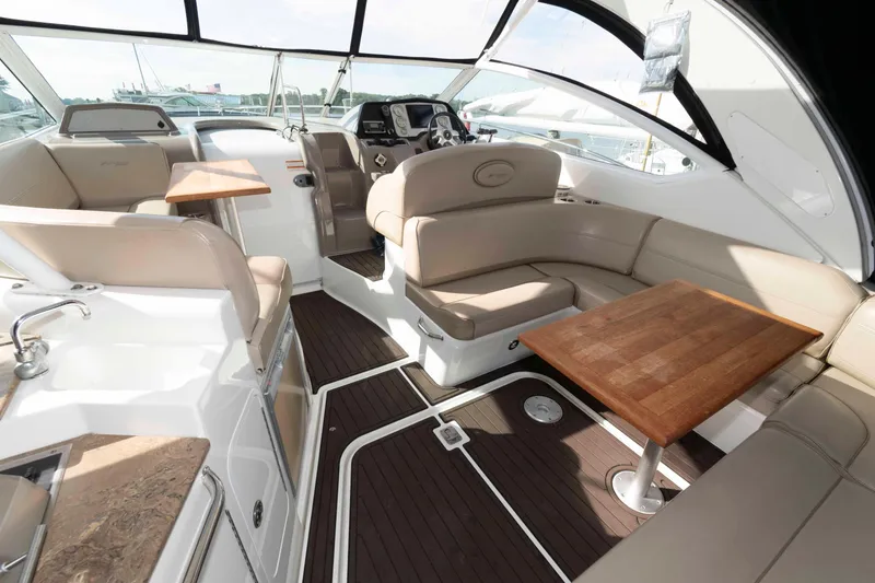 Slide: The Image of Luxurious interior of 2011 Cruisers Yachts 360 Express with elegant seating and wooden tables. - 3