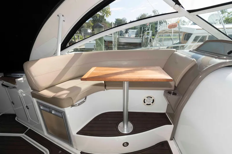 Slide: The Image of Luxurious seating area on 2011 Cruisers Yachts 360 Express with wooden table and leather upholstery. - 8