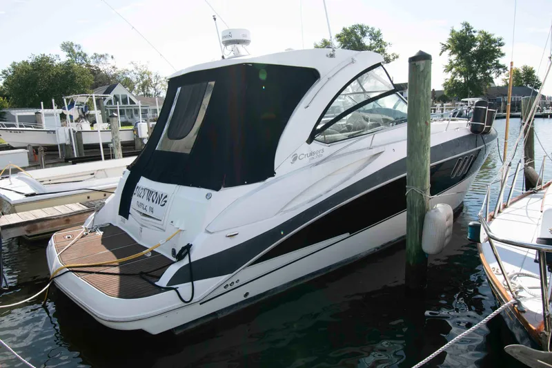The Image of 2011 Cruisers Yachts 360 Express docked at marina, rear view. - 0