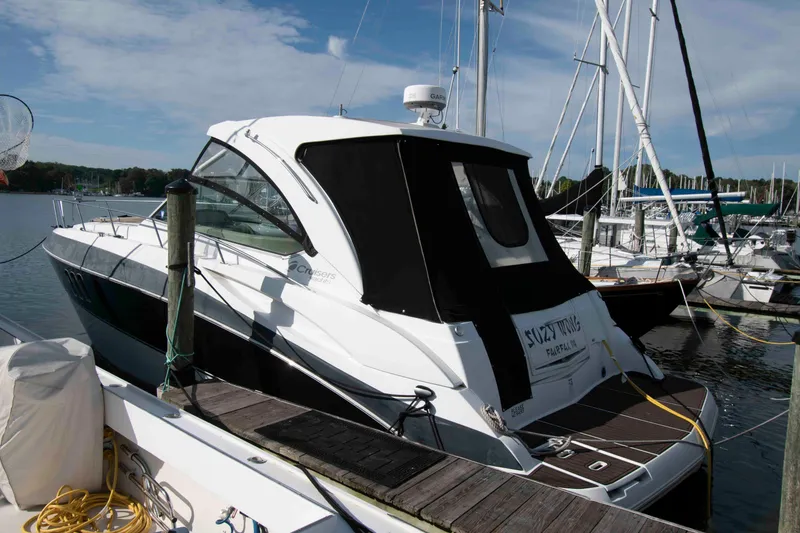 Slide: The Image of 2011 Cruisers Yachts 360 Express docked at a marina under a clear sky. - 1