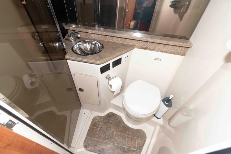 Slide: The Image of Bathroom interior of 2011 Cruisers Yachts 360 Express with sink and toilet. - 16