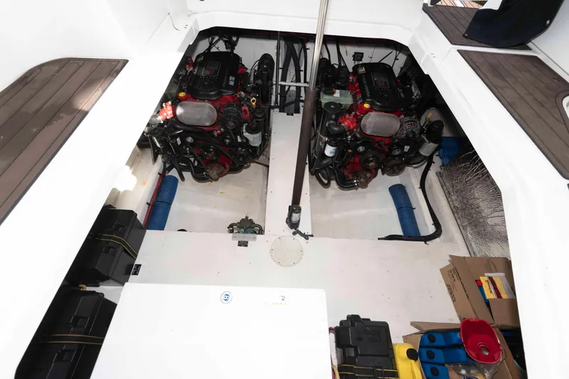 Slide: The Image of Engine compartment of 2011 Cruisers Yachts 360 Express, featuring dual engines and storage space. - 17