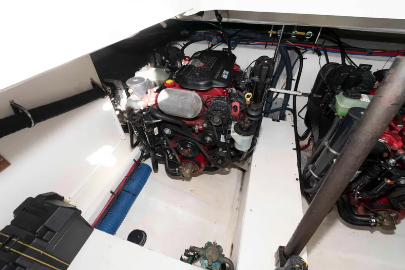 Slide: The Image of Engine compartment of 2011 Cruisers Yachts 360 Express, showcasing dual engines and mechanical components. - 18