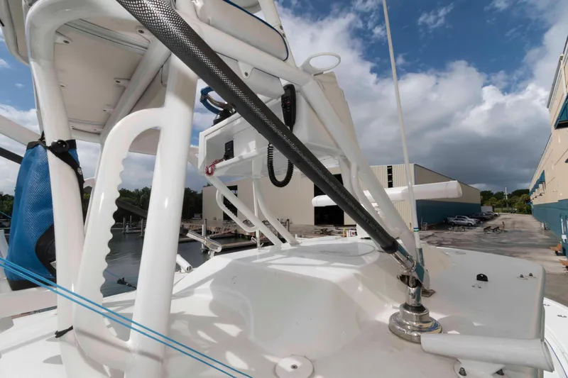 Slide: The Image of 2018 Yellowfin 32 Offshore boat deck with equipment, under a partly cloudy sky. - 20
