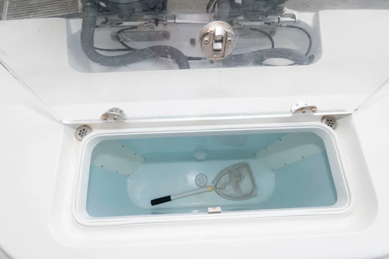 Slide: The Image of Livewell compartment on a 2018 Yellowfin 32 Offshore boat with a net inside. - 21