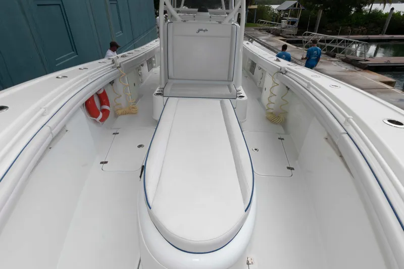 Slide: The Image of 2018 Yellowfin 32 Offshore boat interior with seating and storage compartments. - 23