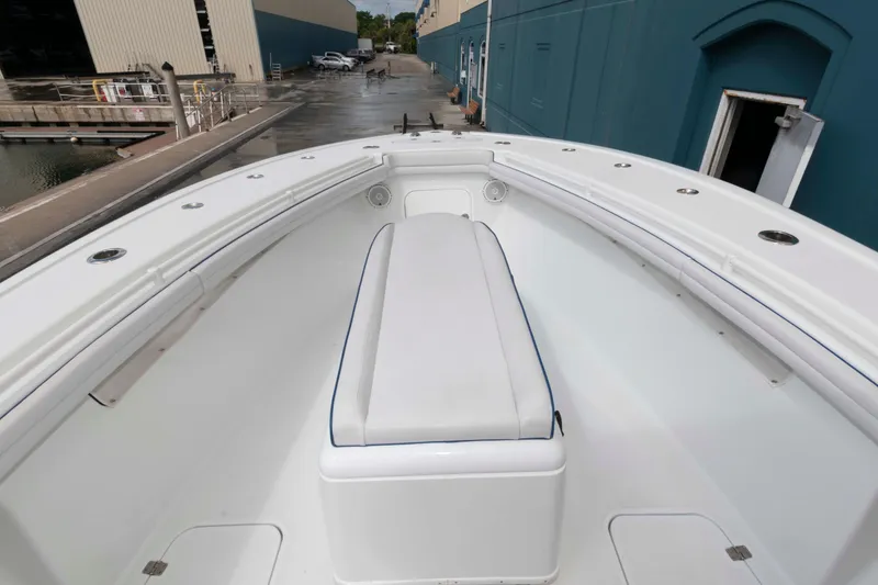 Slide: The Image of 2018 Yellowfin 32 Offshore boat interior with white seating and spacious deck. - 4