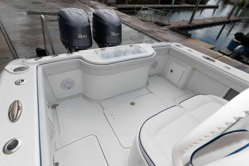 Slide: The Image of 2018 Yellowfin 32 Offshore boat with twin 300 horsepower engines, docked at marina. - 6