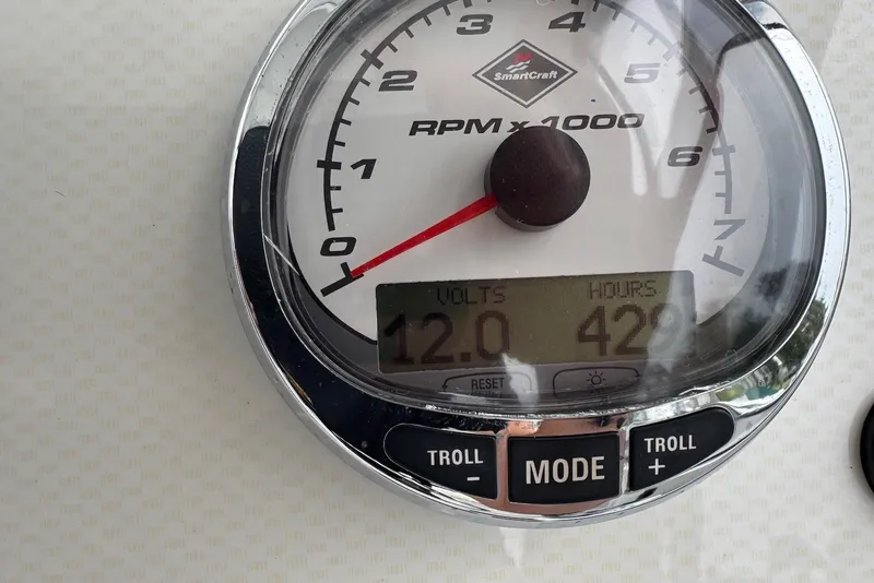 Slide: The Image of Close-up of a 2006 Sea Pro 238 Walk Around boat tachometer displaying 12 volts and 429 hours. - 6