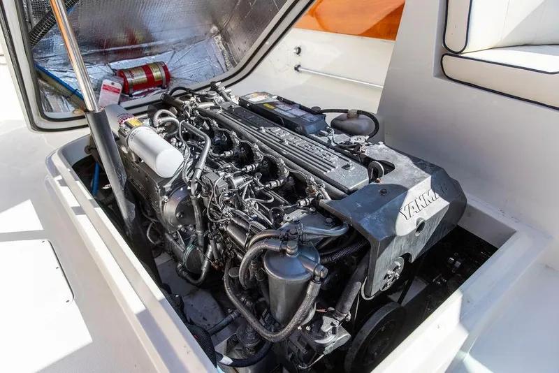 Slide: The Image of Engine compartment of a 2003 Hinckley T29R boat, featuring a Yanmar engine. - 33