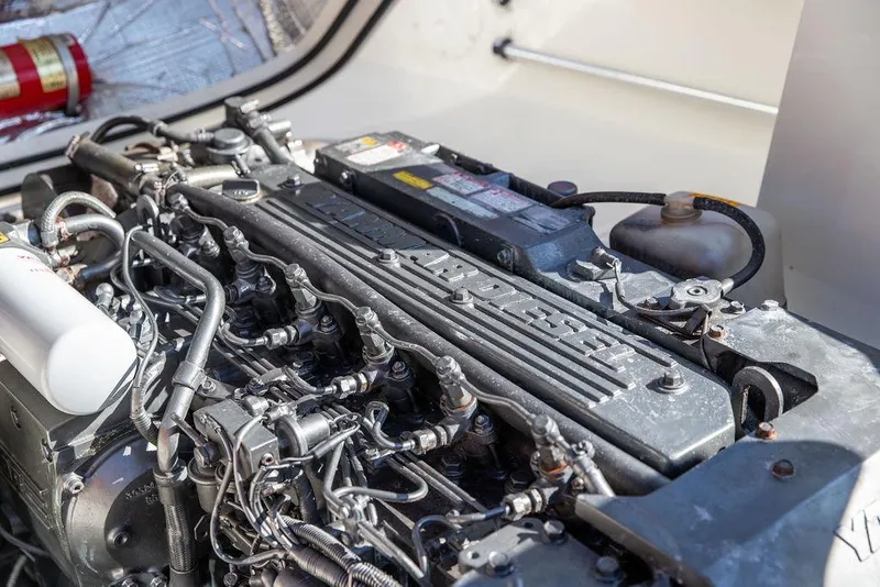 Slide: The Image of Engine of a 2003 Hinckley T29R boat, showcasing detailed mechanical components. - 34