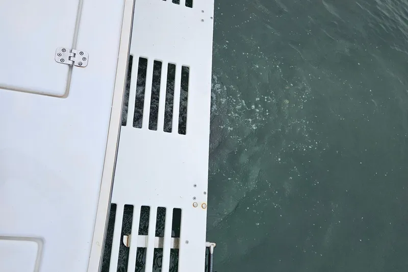 Slide: The Image of Topaz 24 Silverhawk boat deck over water, 2005 model. - 12