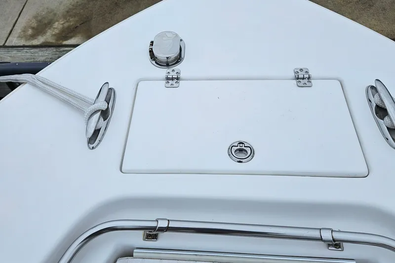 Slide: The Image of 2005 Topaz 24 Silverhawk boat deck with hatch and cleats. - 23