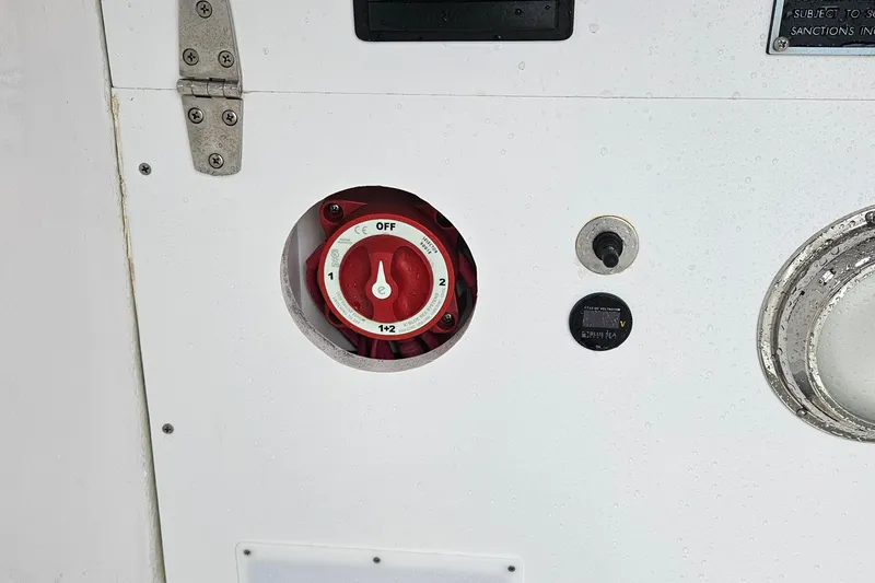 Slide: The Image of Boat battery switch panel on a 2005 Topaz 24 Silverhawk. - 28