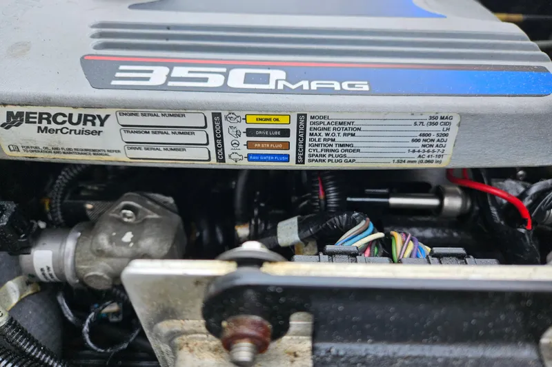 Slide: The Image of Engine compartment of a 2005 Topaz 24 Silverhawk with Mercury 350 MAG specifications. - 35