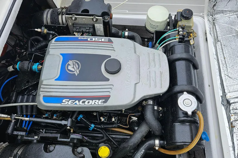Slide: The Image of Engine compartment of a 2005 Topaz 24 Silverhawk with MerCruiser 350 MAG SeaCore engine. - 37