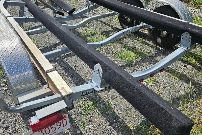 Slide: The Image of Boat trailer for 2005 Topaz 24 Silverhawk on gravel surface. - 42