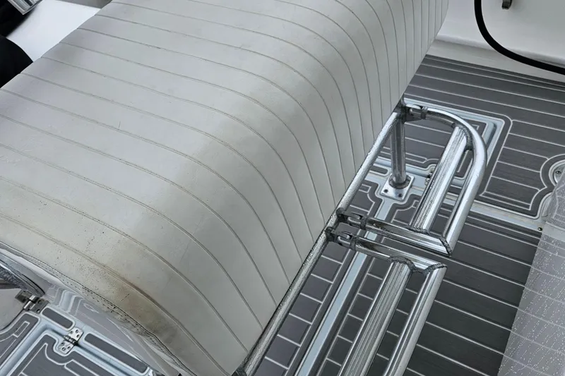 Slide: The Image of White cushioned seat and metal frame on 2005 Topaz 24 Silverhawk boat. - 6
