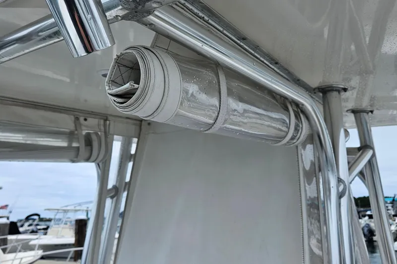 Slide: The Image of Rolled canvas on a 2005 Topaz 24 Silverhawk boat with stainless steel frame. - 8