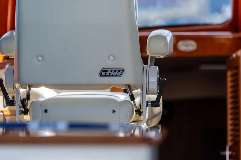 Slide: The Image of Captain's chair on 2017 Hinckley Picnic Boat MKIII, featuring Stidd seating. - 26