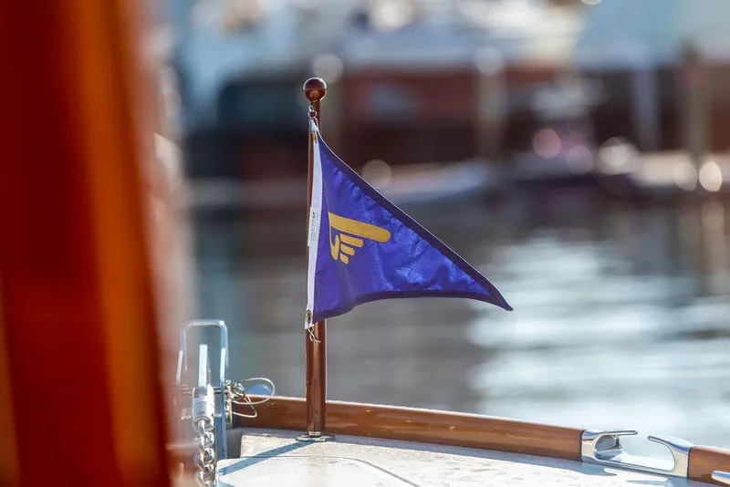 Slide: The Image of Blue flag on 2017 Hinckley Picnic Boat MKIII, docked by the water. - 42