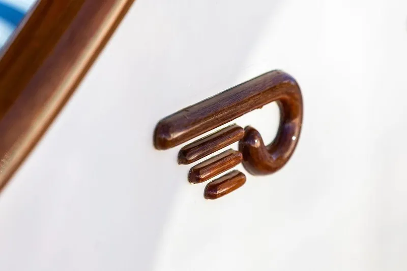 Slide: The Image of Wooden detail on 2017 Hinckley Picnic Boat MKIII, showcasing elegant craftsmanship. - 44