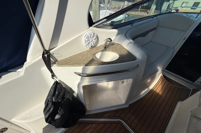 Slide: The Image of 2009 Chaparral Signature 280 boat interior with sink and seating area. - 13