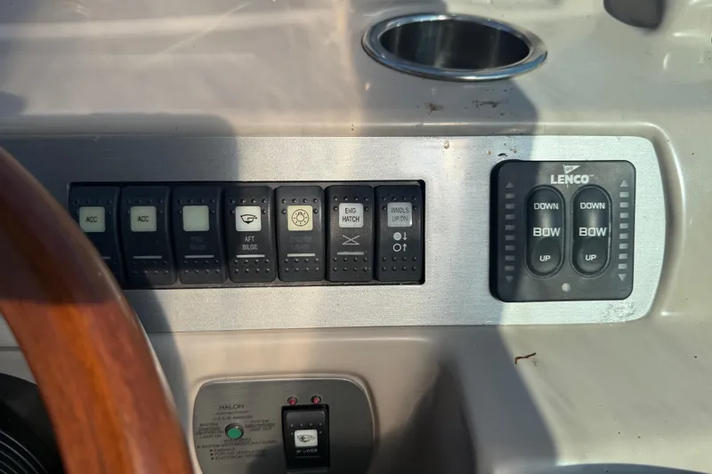 Slide: The Image of Control panel of a 2009 Chaparral Signature 280 boat with various switches and buttons. - 18