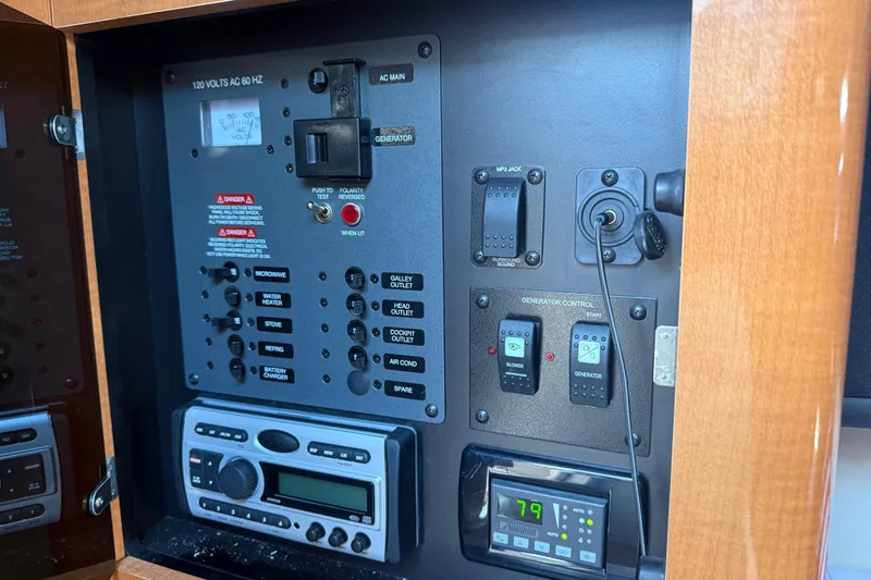 Slide: The Image of Control panel of a 2009 Chaparral Signature 280 boat, featuring various switches and displays. - 25
