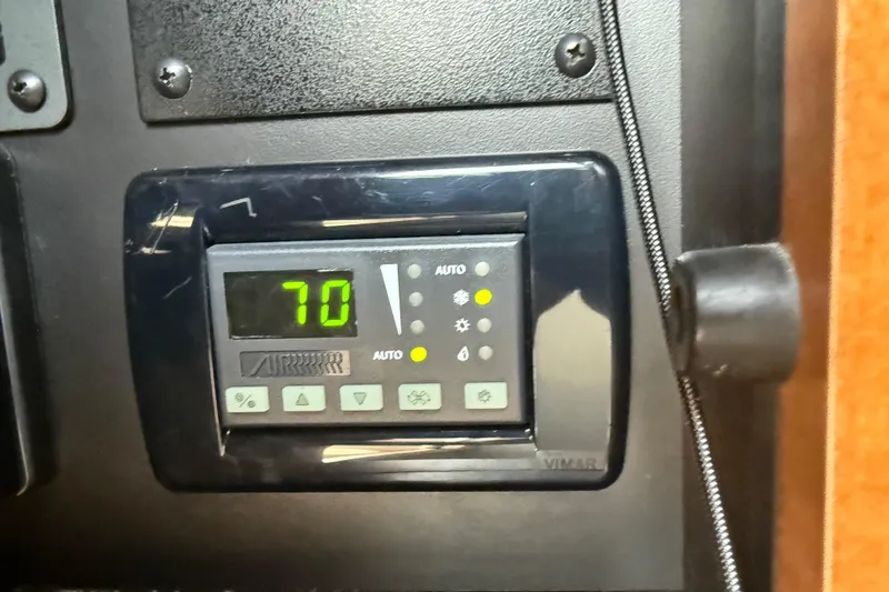 Slide: The Image of Digital control panel on 2009 Chaparral Signature 280 boat, displaying temperature at 70 degrees. - 28