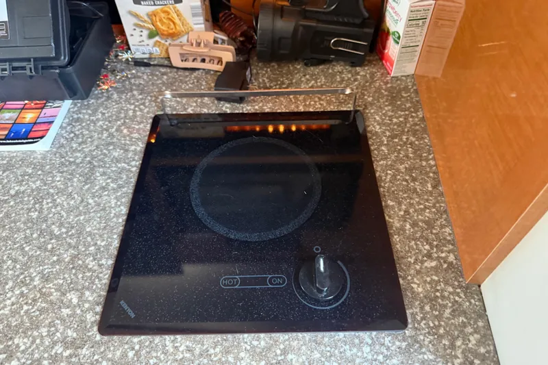 Slide: The Image of Electric cooktop on Chaparral Signature 280 boat, 2009 model, with countertop items. - 29