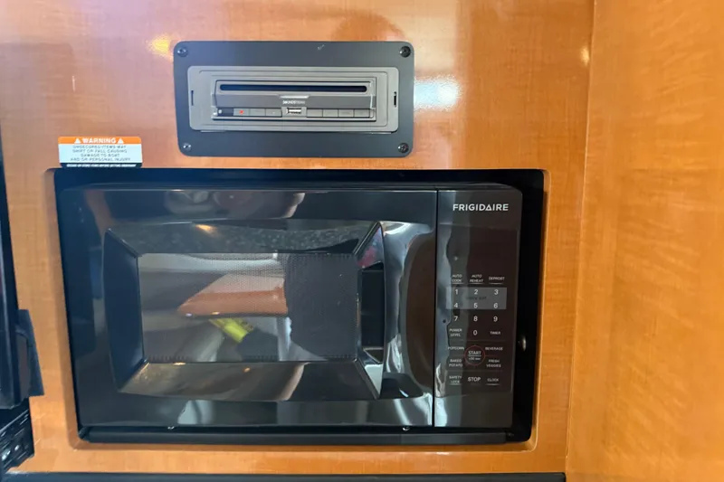 Slide: The Image of Frigidaire microwave in 2009 Chaparral Signature 280 boat interior. - 32