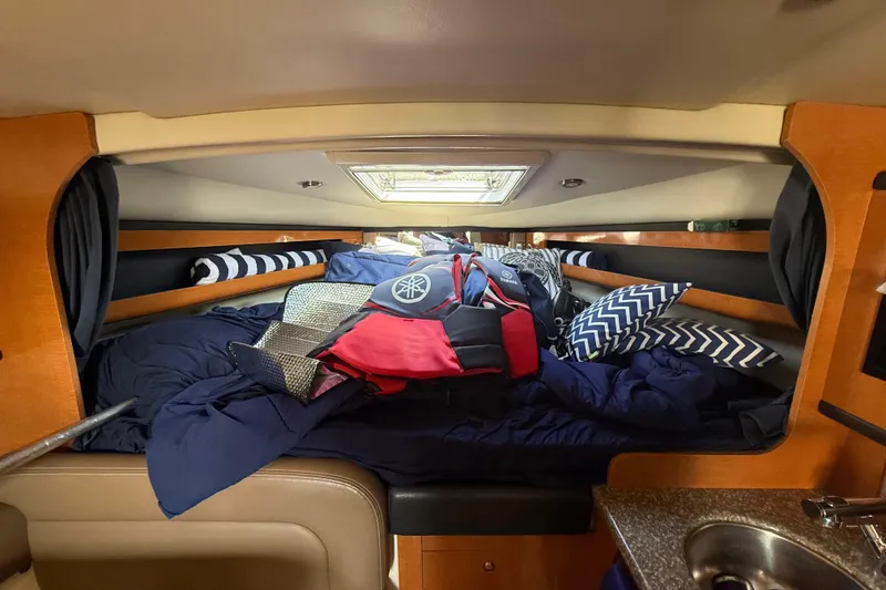 Slide: The Image of Interior cabin of 2009 Chaparral Signature 280 with bedding and cushions. - 35