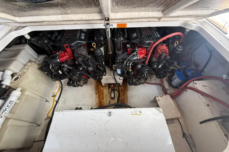 Slide: The Image of Engine compartment of a 2009 Chaparral Signature 280 boat, featuring dual engines and mechanical components. - 39