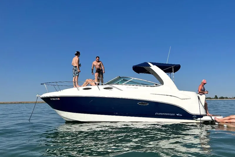 Slide: The Image of 2009 Chaparral Signature 280 boat with people enjoying a sunny day on the water. - 42