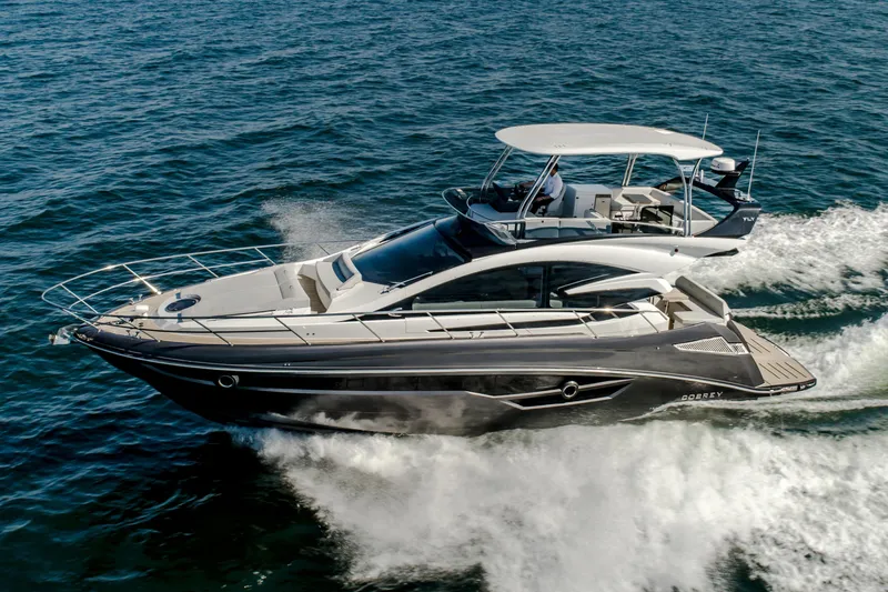 Slide: The Image of 2026 Cobrey 52 FLY yacht cruising on open water, showcasing sleek design and luxury features. - 3