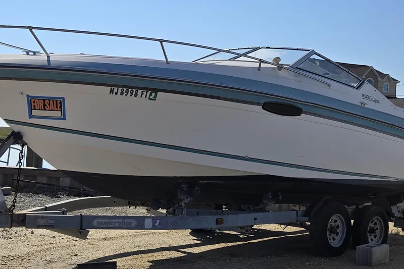 The Image of 1992 Wellcraft Eclipse 233 boat for sale on trailer, side view. - 0