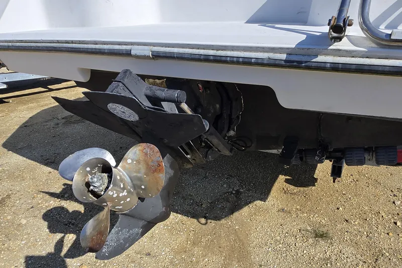 Slide: The Image of 1992 Wellcraft Eclipse 233 boat propeller and stern view on dry land. - 8