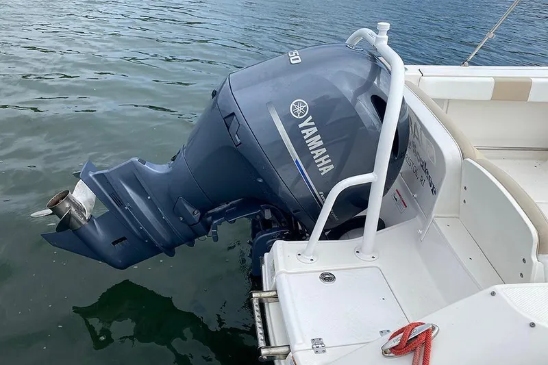 Slide: The Image of 2019 Robalo R207 Dual Console with Yamaha outboard motor on water. - 12