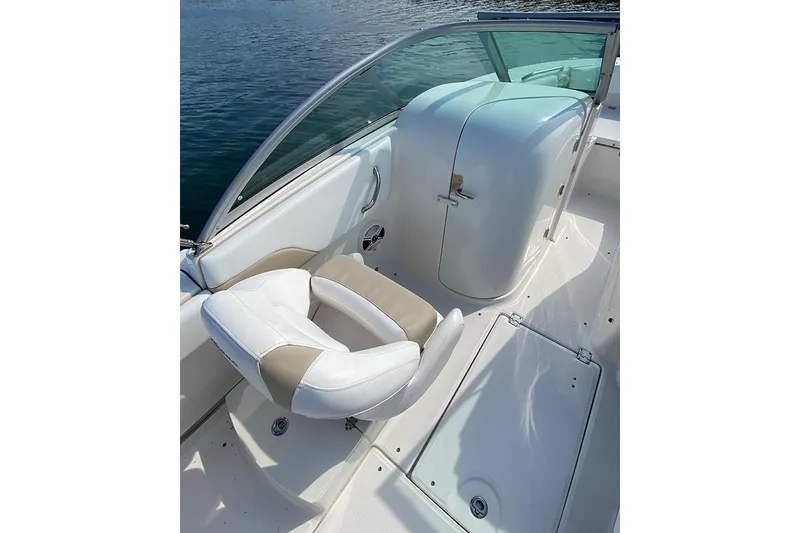 Slide: The Image of 2019 Robalo R207 Dual Console boat interior with white seating and console. - 4