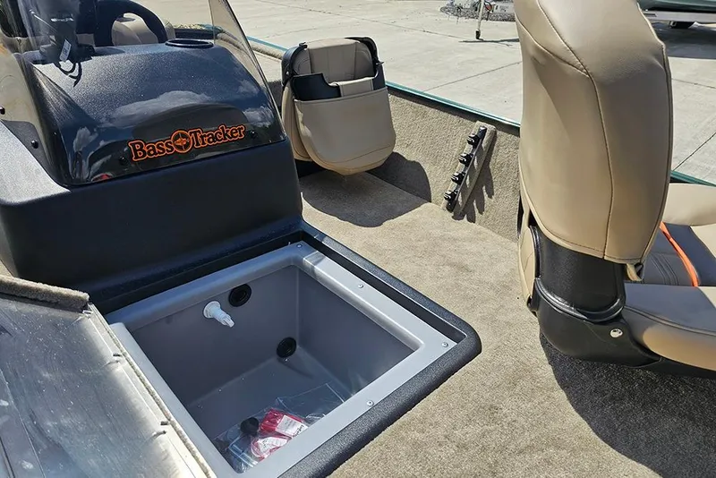 Slide: The Image of 2026 Tracker Bass Tracker Classic Limited boat interior with seating and storage compartment. - 10