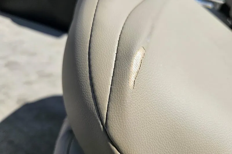 Slide: The Image of Torn seat upholstery on 2026 Tracker Bass Tracker Classic Limited boat. - 13