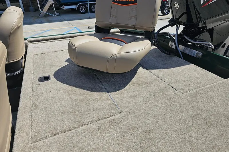 Slide: The Image of 2026 Tracker Bass Tracker Classic Limited boat interior with cushioned seating and carpeted deck. - 5